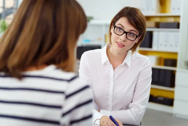 cognitive-behavioral therapy a woman meeting with a therapist for cognitive behavioral therapy