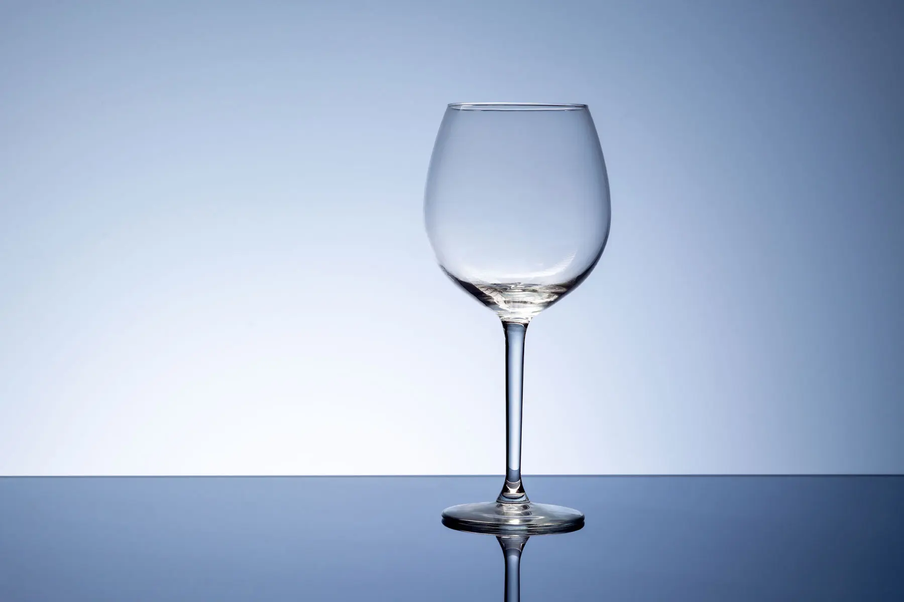 Does Alcohol Cause Depression and Anxiety an empty wine glass sits on a table