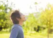 a man practices meditation outside as an anxiety therapy technique