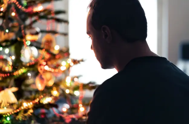 How-to-Handle-Depression-During-the-Holidays a man struggles to cope with depression during the holidays
