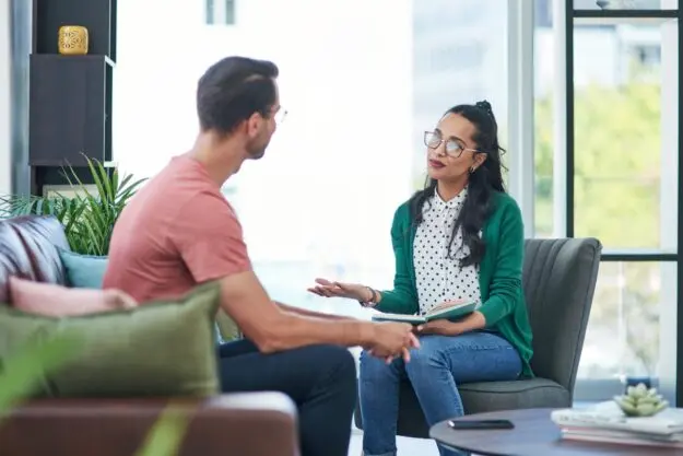 Is a Mental Health IOP Right for Me_ a person talks to a therapist about a mental health iop