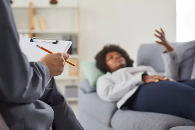 What Is Moral Reconation Therapy someone lays on a couch and talks to a therapist about what is moral reconation therapy