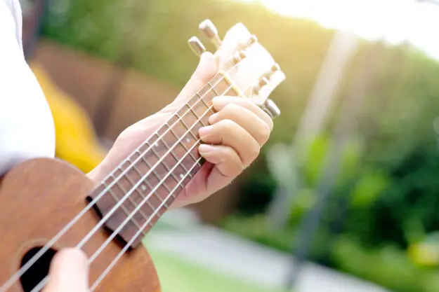 What are the Types of Music Therapy someone plays guitar to show the types of music therapy