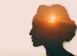 artistic rendering of the sun setting in the mind of a woman