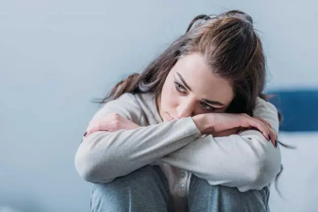 What-to-Know-About-BPD-and-Anxiety a woman struggles to cope with bpd and anxiety