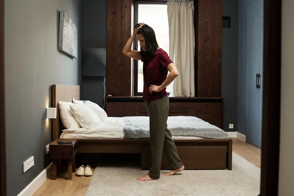 Individual experiencing symptoms of OCD or OCPD, reflecting alone in a quiet space