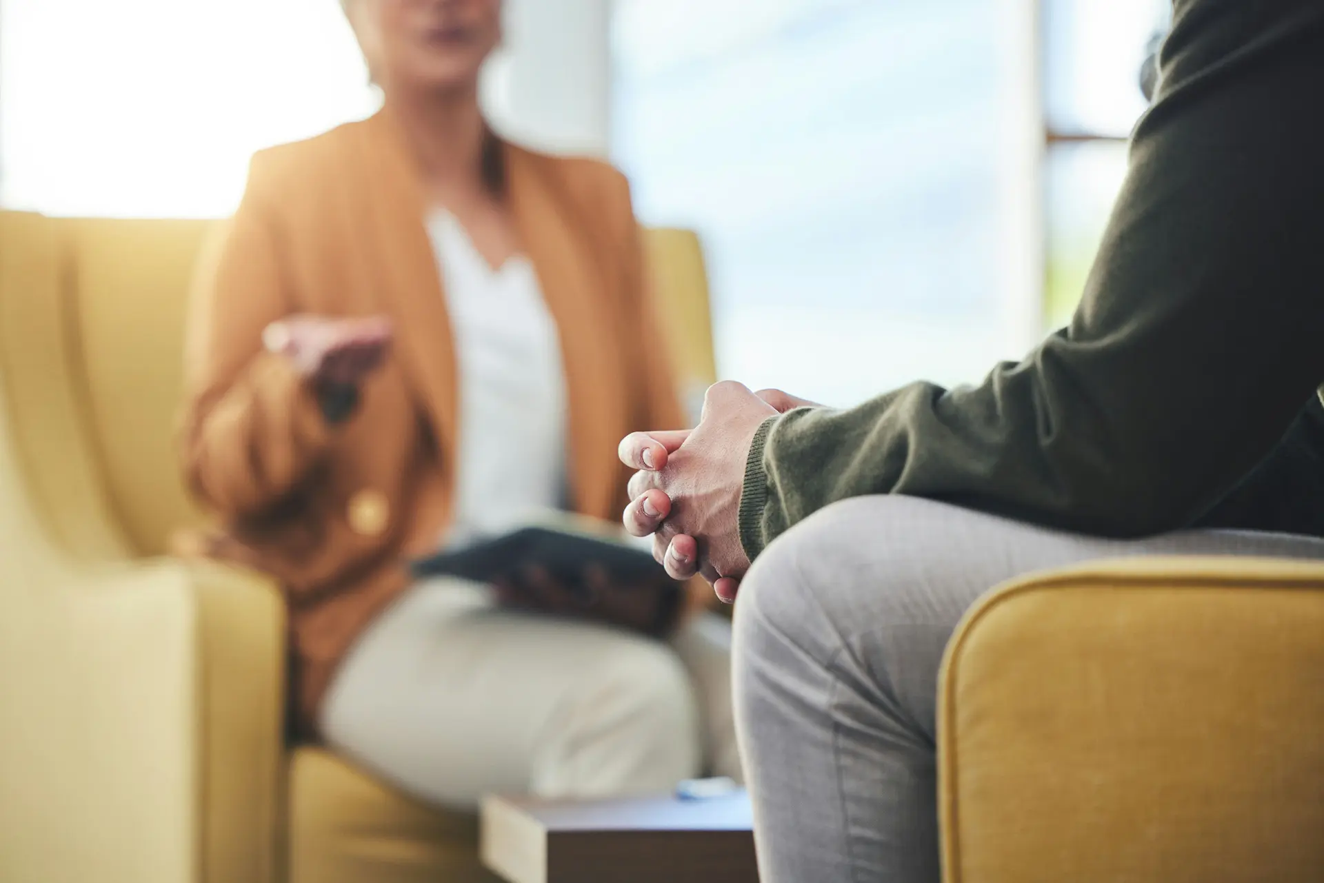 Family member speaking with a legal or clinical professional about Marchman Act options
