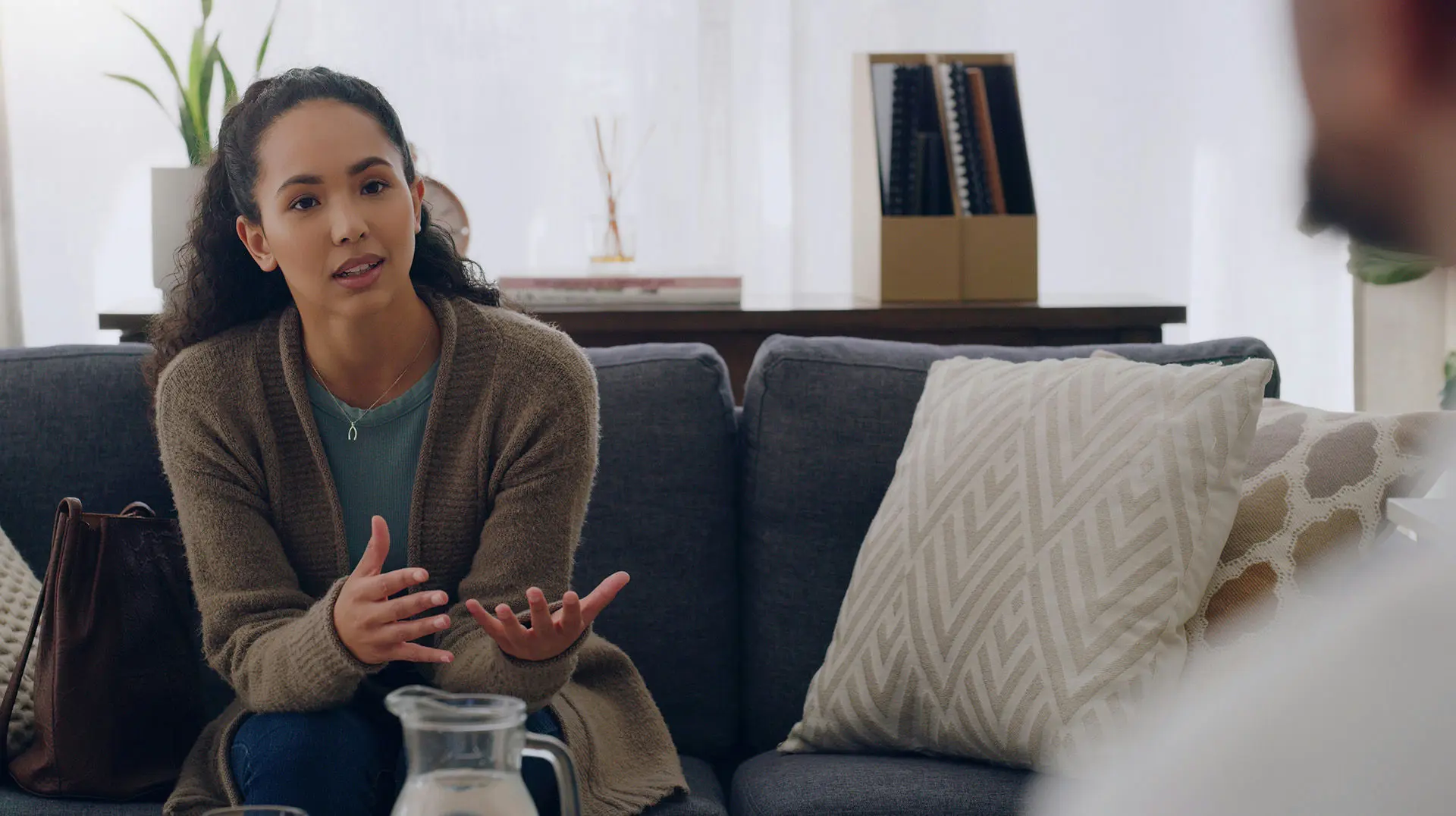 Individual discussing treatment-resistant anxiety with a therapist in a supportive setting.