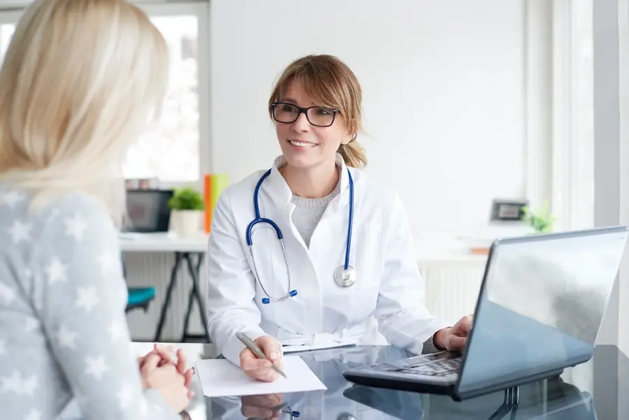 Adult speaking with doctor about medication concerns