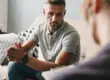 Therapist discussing inpatient vs outpatient mental health treatment options