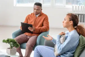 a therapist talks to a patient in an individual therapy program
