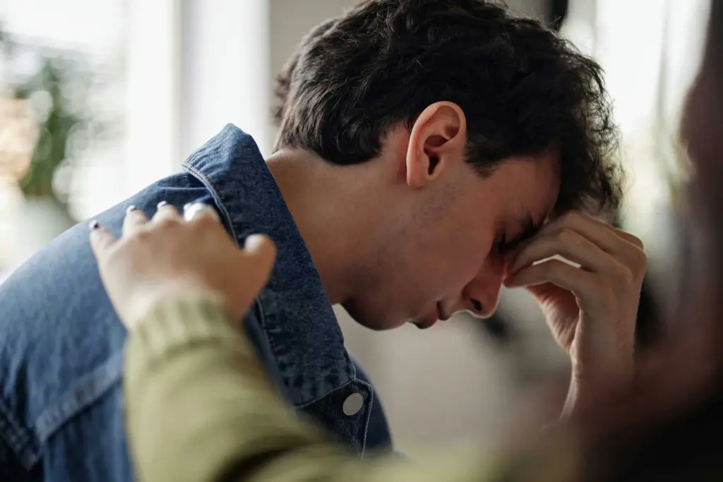 Person coping with anxiety, depression, and self-harm urges