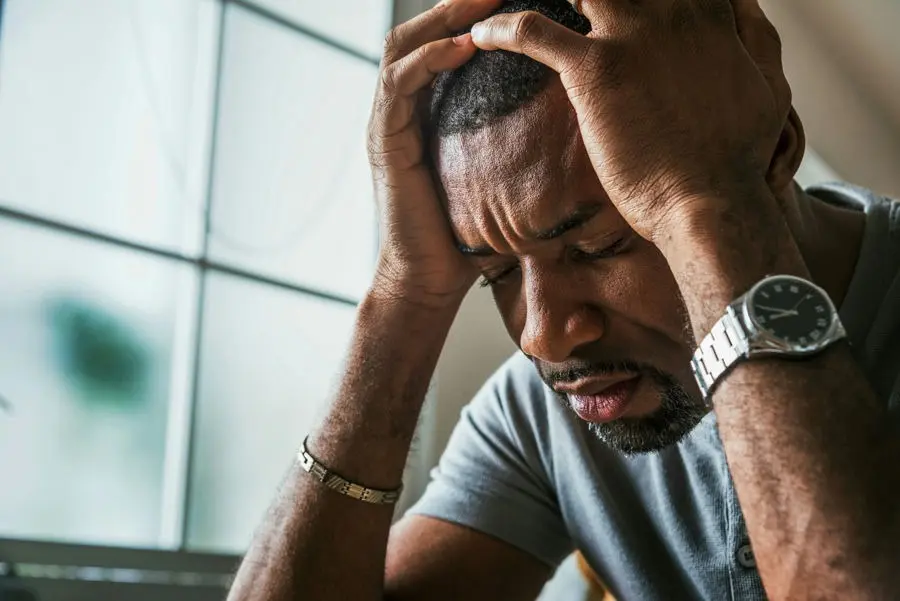 Individual experiencing flashbacks and anxiety, highlighting the disruptive symptoms of PTSD.