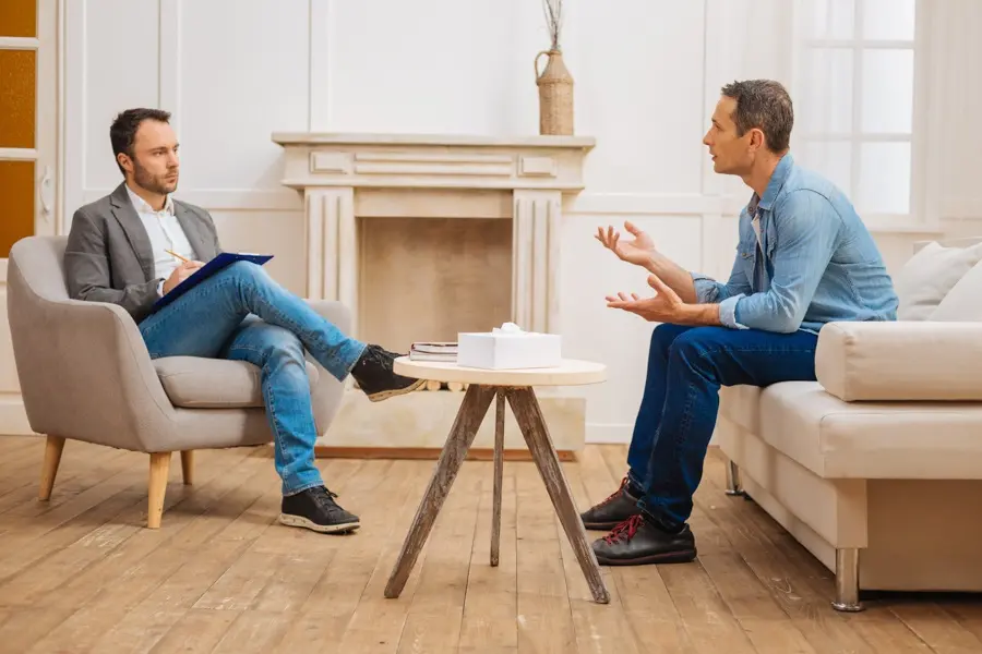 young man talks with therapist in Tavares, Florida.