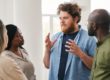 a diverse group opens up to each other by doing various activities in group therapy as part of mental health treatment