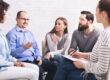 a group of people sit in a circle and learn about the benefits of 12 step program