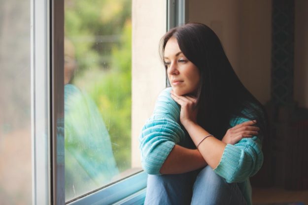 a woman debates attending a CBT program