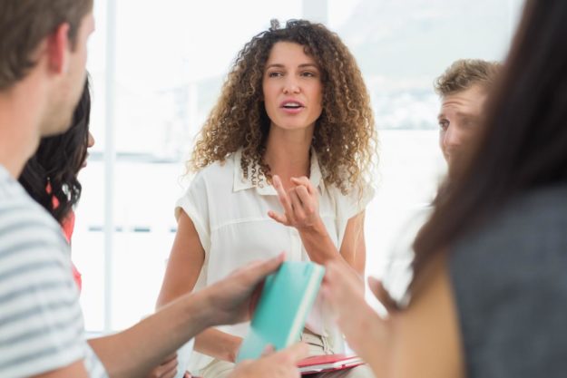 a woman participates in 12 step therapy for mental health