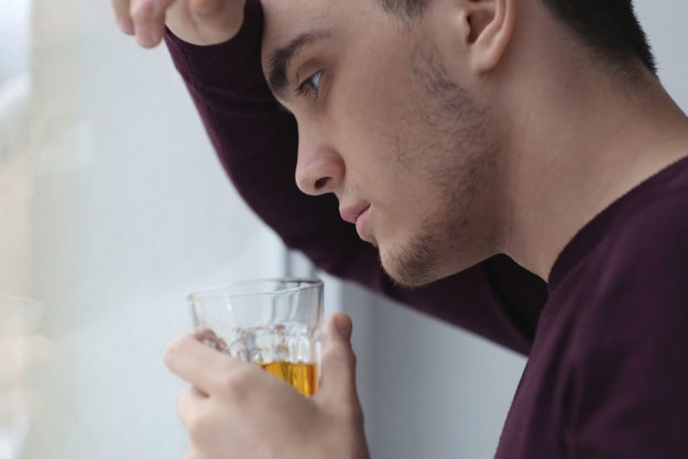 a man struggles with alcohol and depression