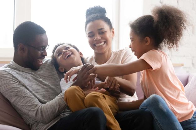parents with children happy after family therapy