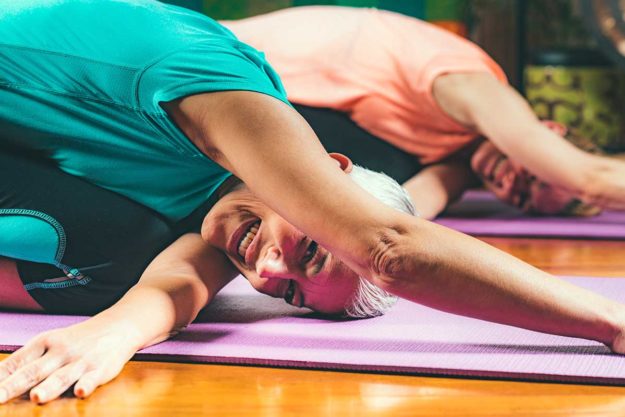 individuals doing yoga and trauma