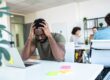 a man struggles with the symptoms of an undiagnosed mental health disorder at work
