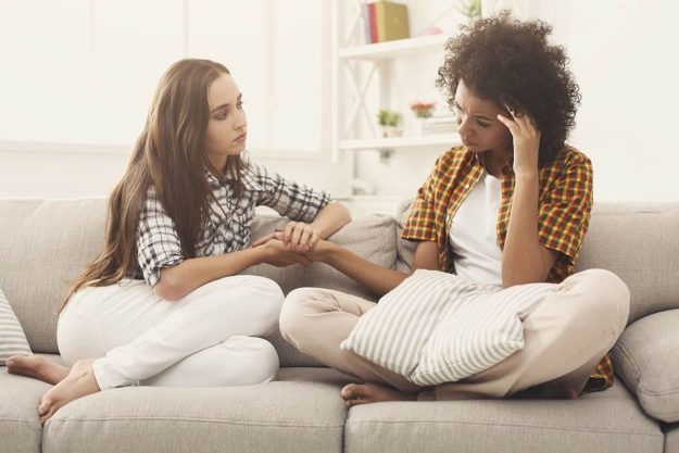 a woman and her friend having a mental health treatment discussion