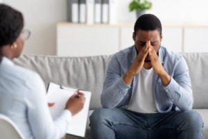 a man talks to a therapist at a ptsd treatment program in florida 