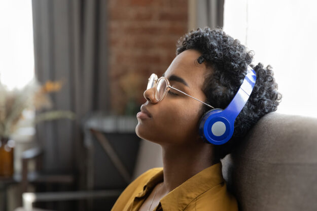 a person with headphones engaging in music therapy for depression