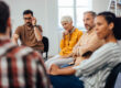 a group of people participate in group therapy activities for adults