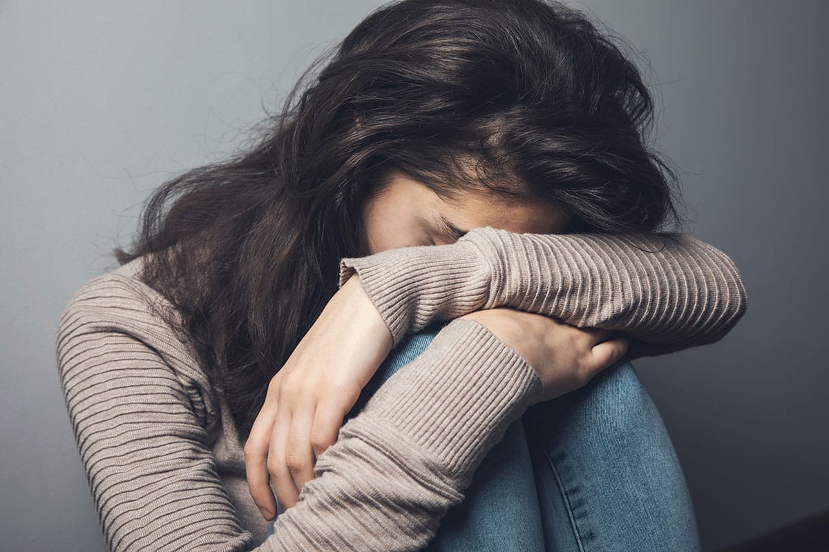 Woman struggling with self-injury and cutting