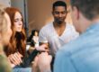 individuals in group therapy for mental health meditate together as part of their holistic treatment