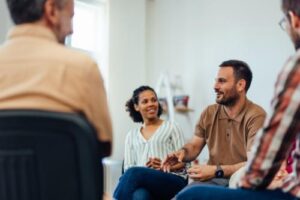 A group of people in a mental health alumni program