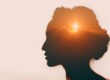 artistic rendering of the sun setting in the mind of a woman