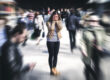 a woman struggles to manage a trauma response in a large crowd