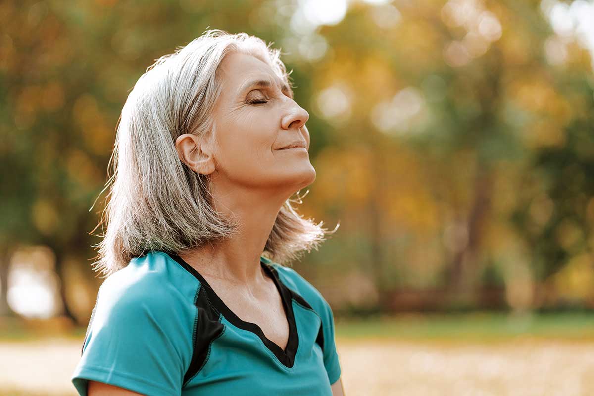 a woman practices coping skills she learned for depression to make herself feel better