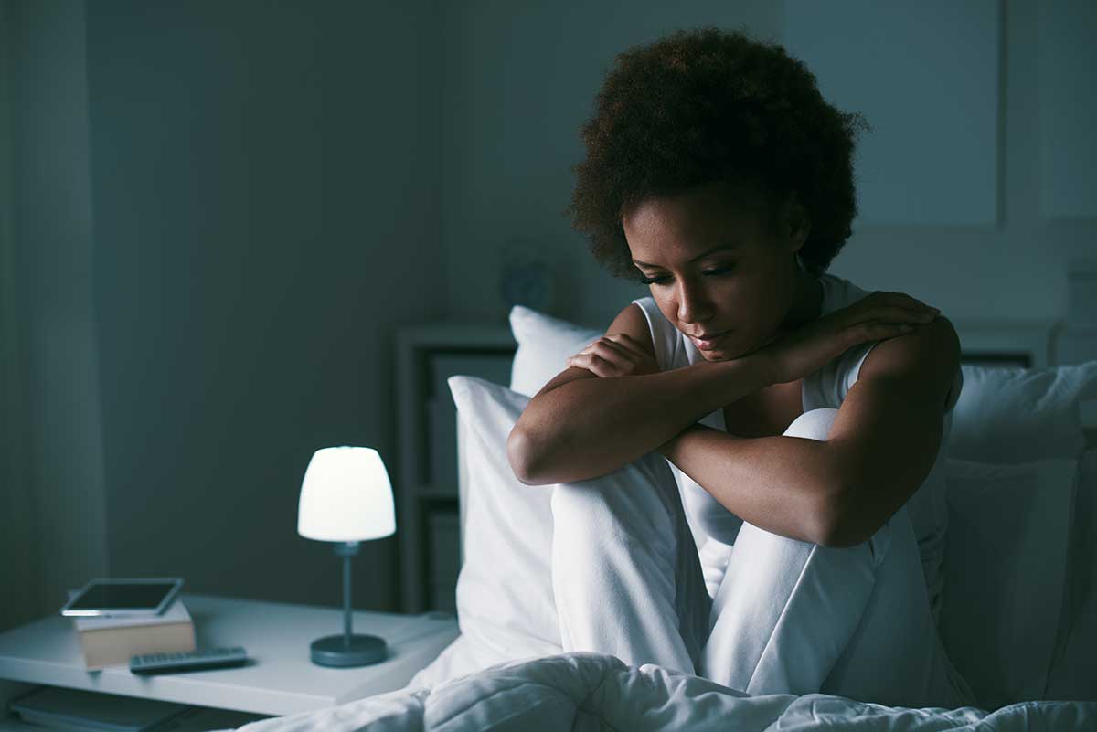 a woman struggles with insomnia due to the effect of anxiety on the brain