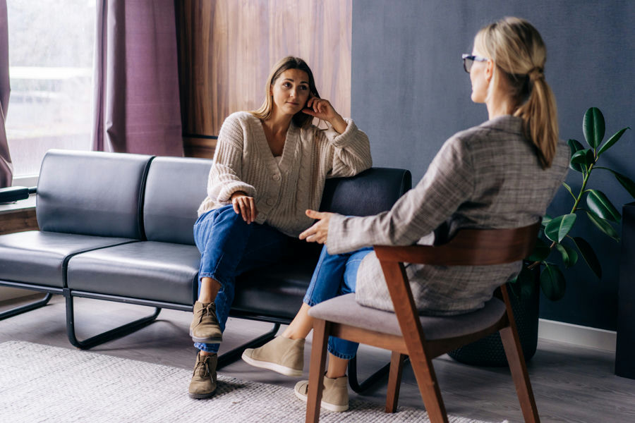 Licensed therapist and client in a psychotherapy session in Florida, discussing mental health support.
