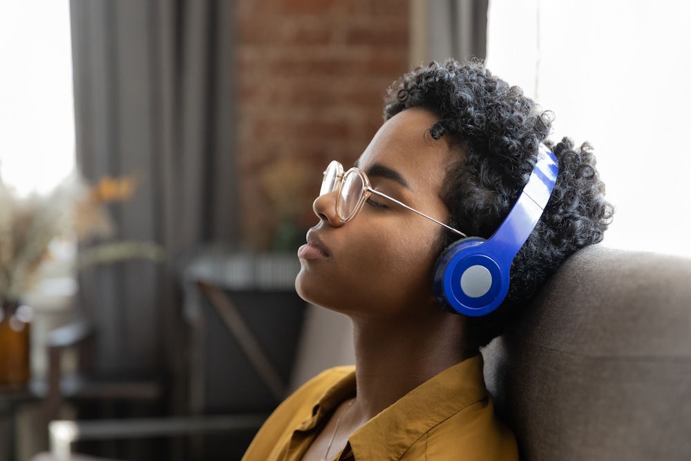 Client in Florida experiencing the emotional and cognitive benefits of music therapy through guided music listening