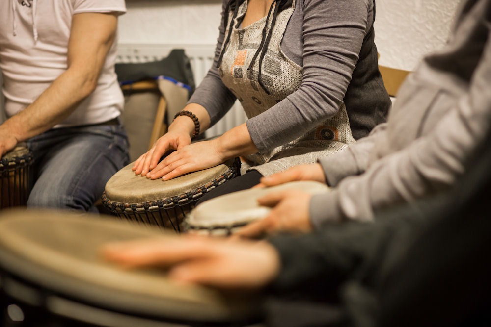 Adults engaging in inclusive group music therapy at a mental health center in Florida