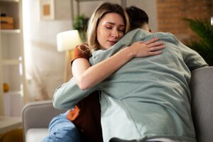 Offering emotional support and encouragement to a loved one in recovery