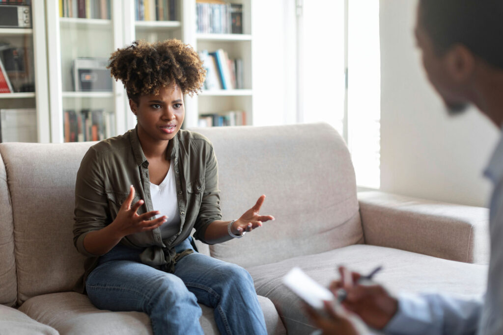 Therapist and client engaging in a dual diagnosis treatment session for anxiety and addiction.