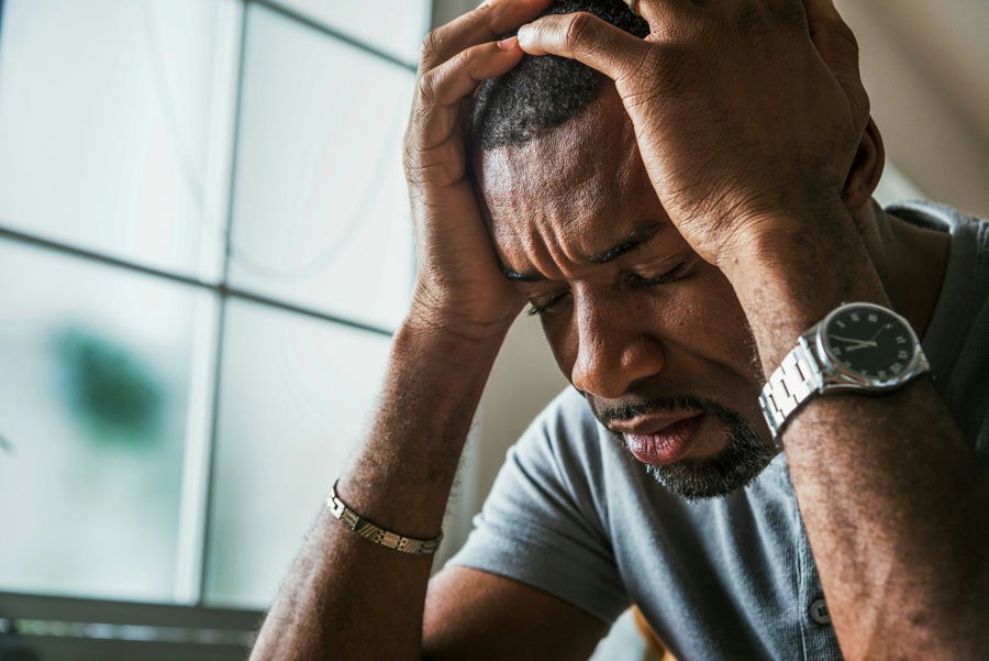 Individual experiencing flashbacks and anxiety, highlighting the disruptive symptoms of PTSD.