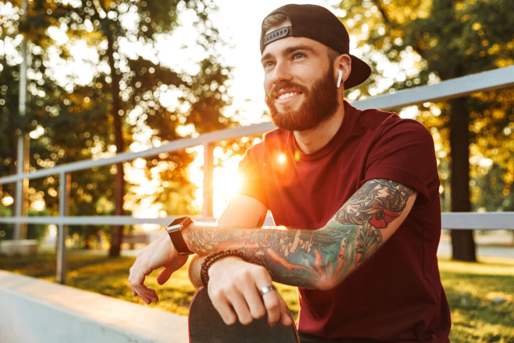 man sitting in a peaceful environment reflecting continued healing through a mental health alumni program