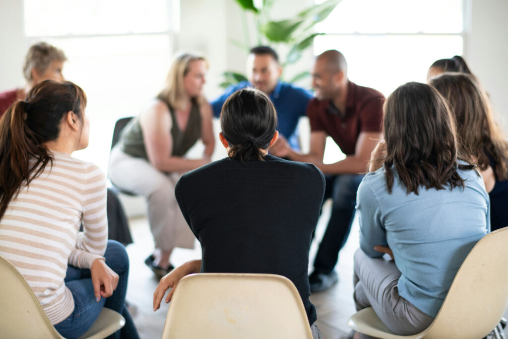 Group therapy session focused on emotional regulation and coping skills using dialectical behavior therapy