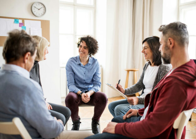 group therapy participants learning SMART Recovery tools for addiction and mental health recovery.