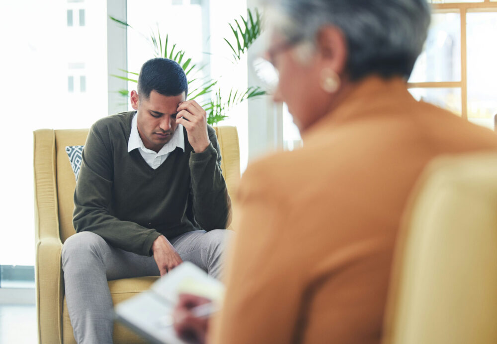 mental health therapist meeting privately with a client during a residential treatment session.